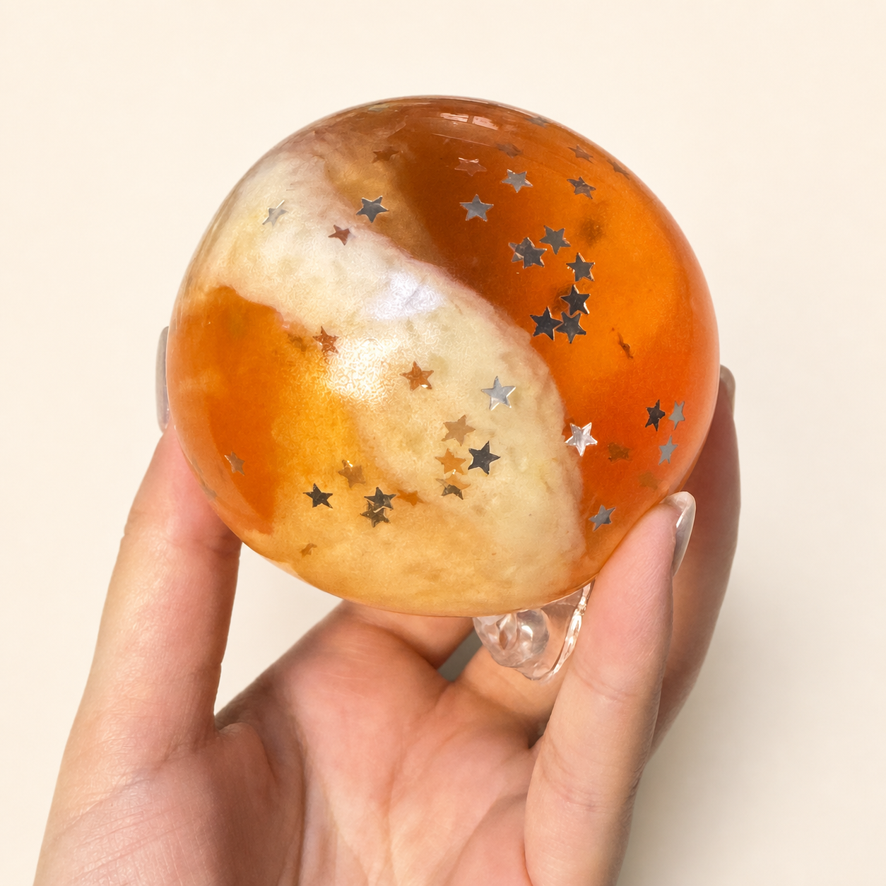 Close-up of the orange and cream Amber Twilight Slush Sensory Ball