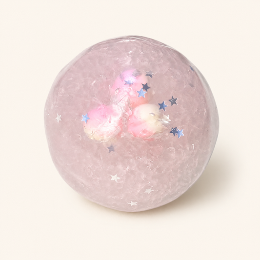 Peach Stardust Slush Sensory Ball on a milk-white background