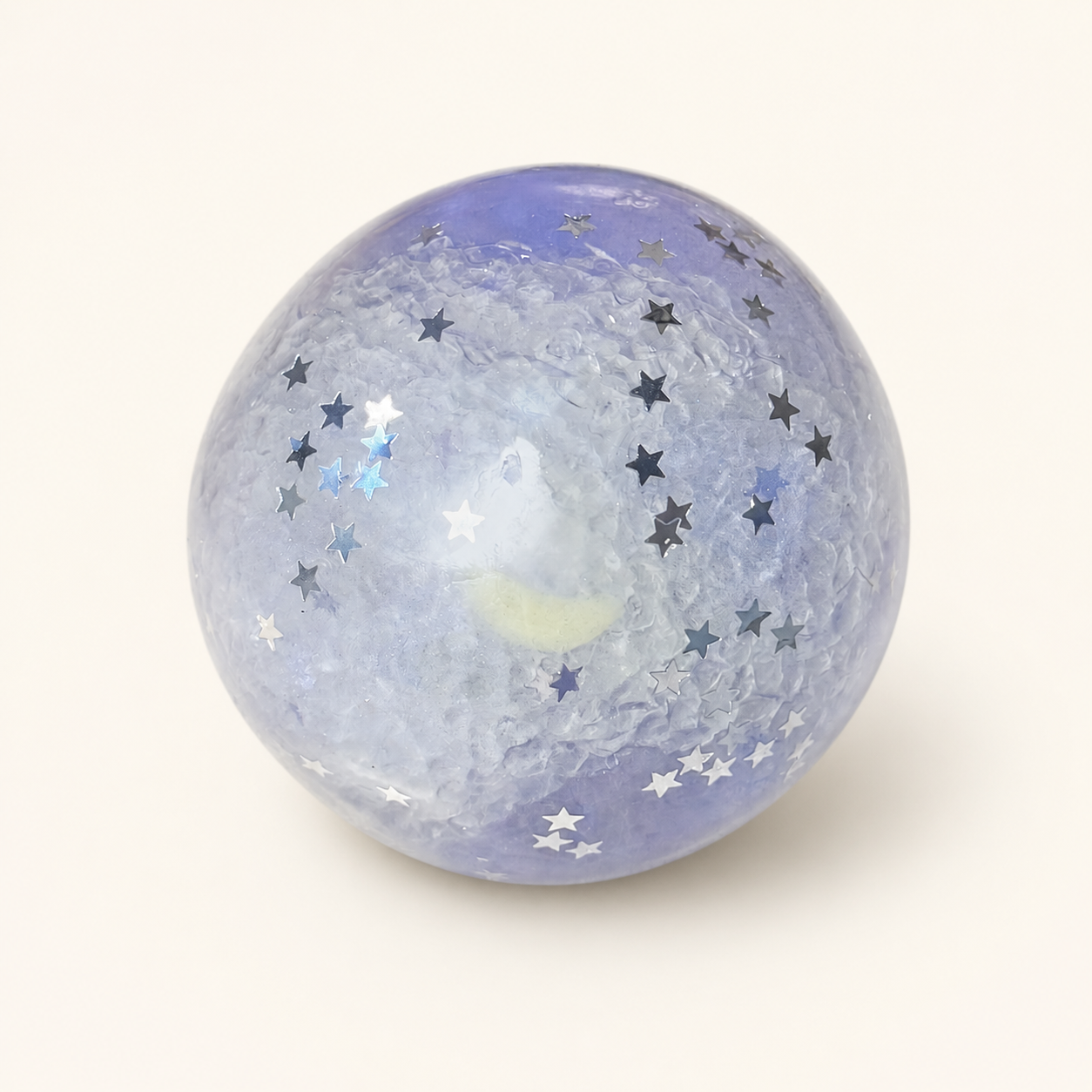 Purple Mist Stardust Slush Sensory Ball on a milk-white background