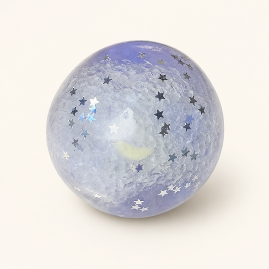 Purple Mist Stardust Slush Sensory Ball on a milk-white background